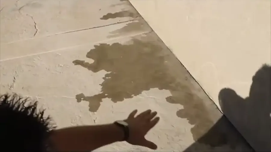 Plumber using acoustic ground microphone to locate slab leak in Tyler TX home
